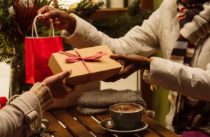 people exchanging gifts in the winter